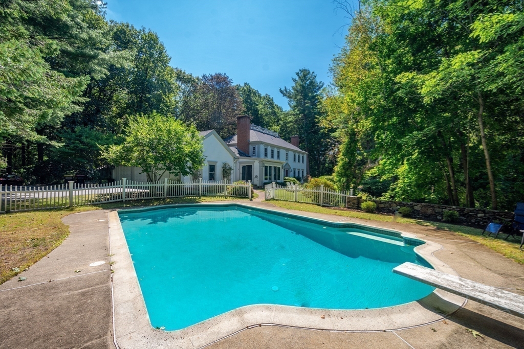 138 Pine Street Dover, MA 02030 - Photo 35 of 38 a view of a swimming pool with lounge chair