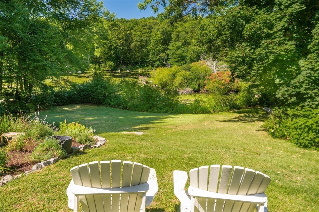 138 Pine Street Dover, MA 02030 - Photo 36 of 38 a view of a lake with a yard
