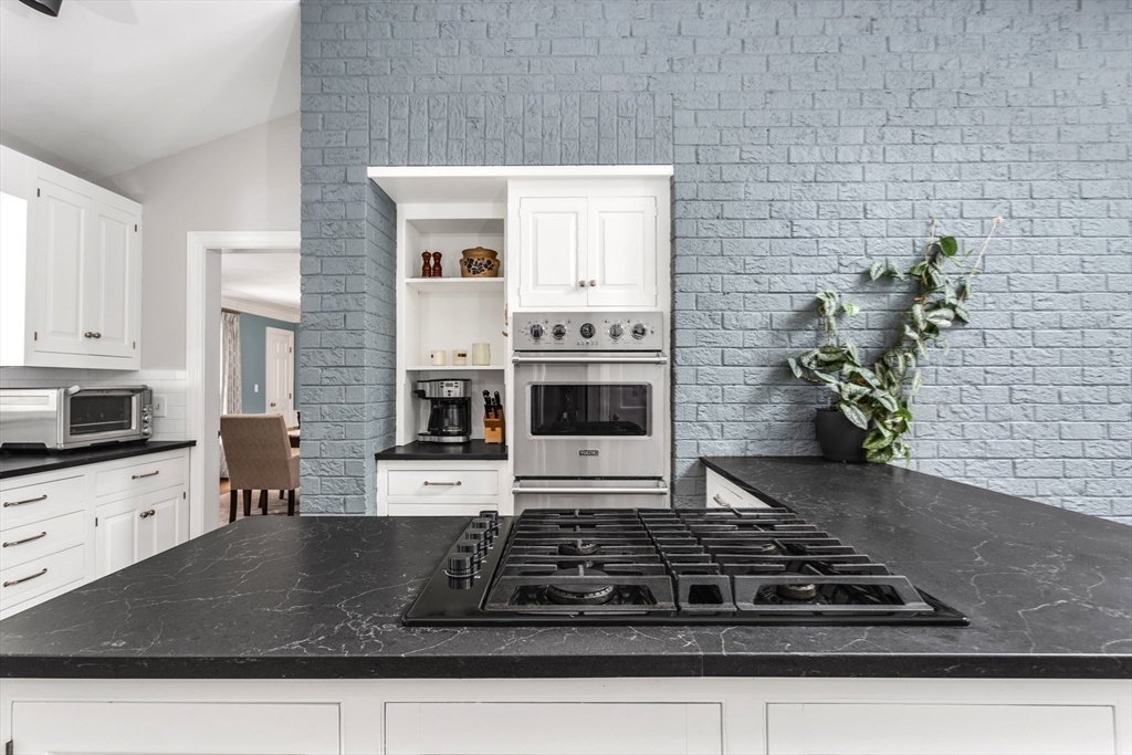 138 Pine Street Dover, MA 02030 - Photo 5 of 38 a kitchen with stainless steel appliances granite countertop a stove a sink and a granite counter tops