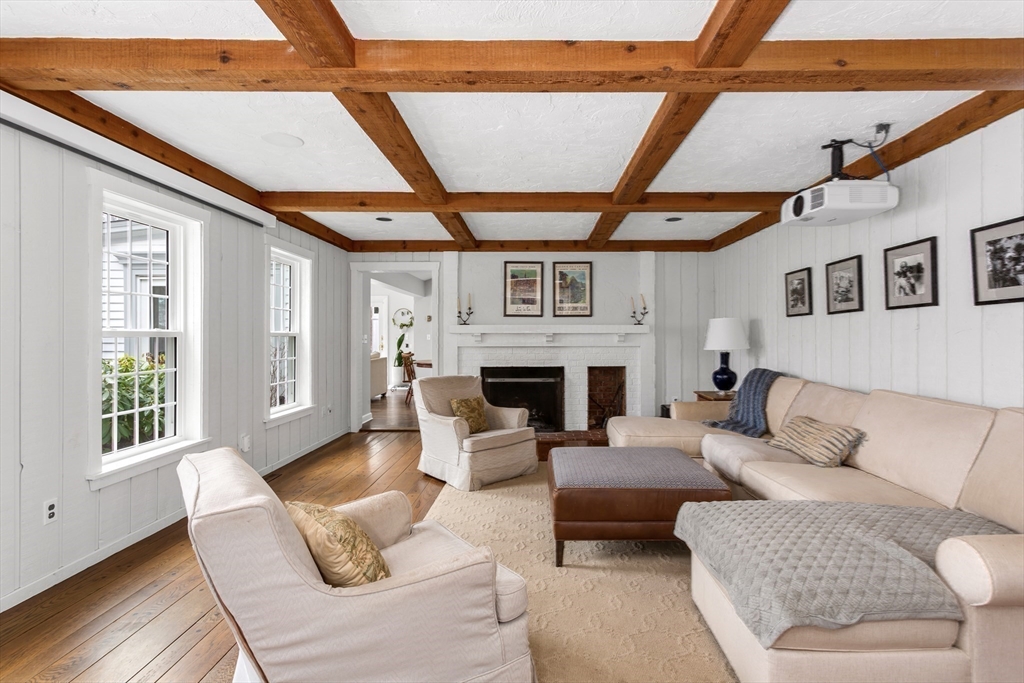 138 Pine Street Dover, MA 02030 - Photo 9 of 38 a living room with furniture a fireplace and a large window