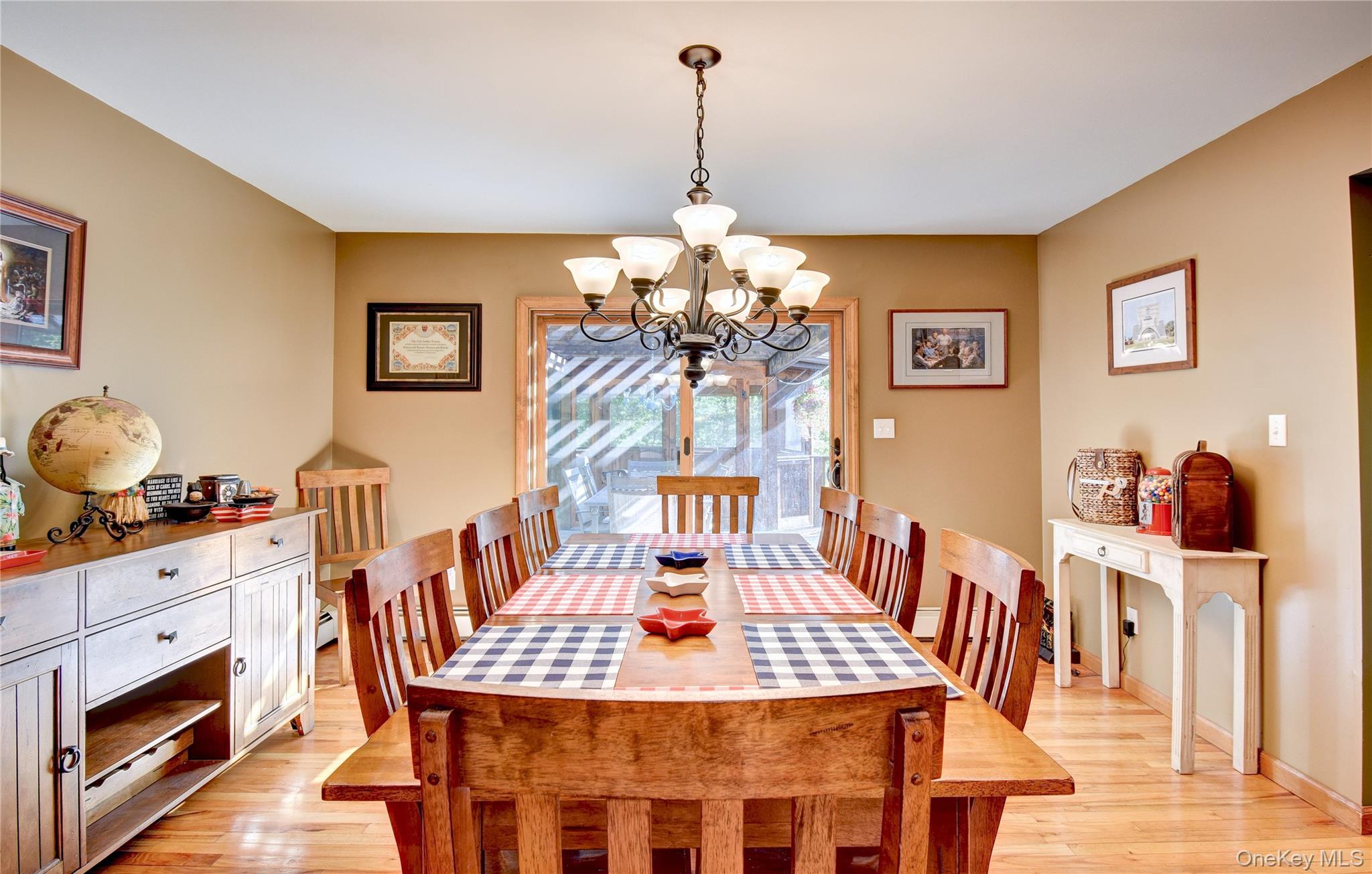 29 Valley View Road Bloomingburg, NY 12721 - Photo 11 of 50 a view of a dining room with furniture a chandelier and wooden floor