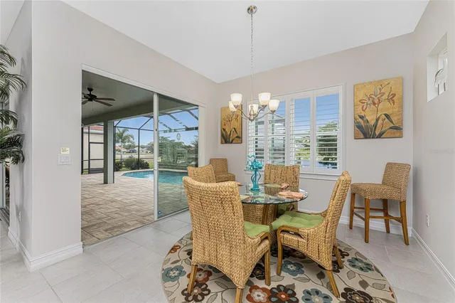 a bedroom with a bed and a flat tv screen on dresser
