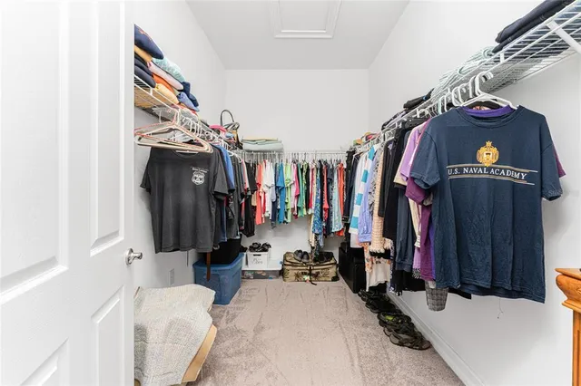 a view of a swimming pool with a lounge chair