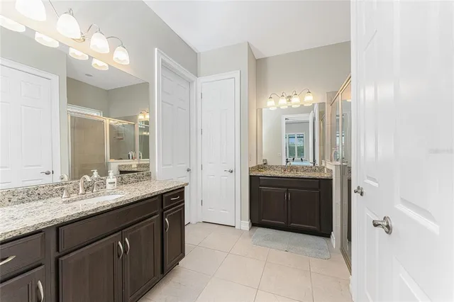 a view of a backyard with plants and a patio