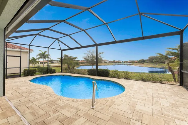 a view of a park with a slide and palm trees