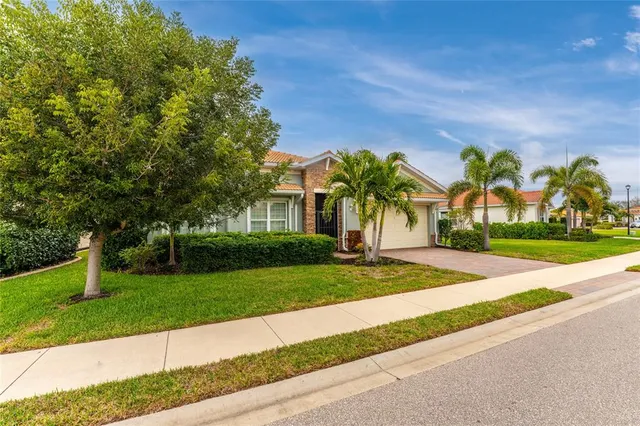 an aerial view of a house with a swimming pool and outdoor space