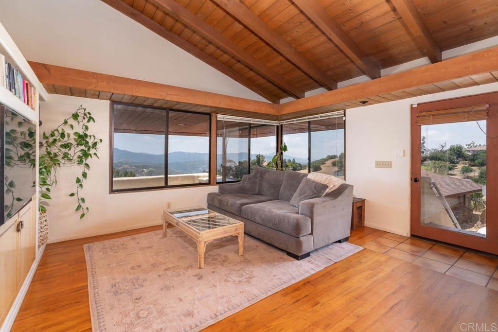 315 Alpine Heights Road Alpine, CA 91901 - Photo 13 of 42 a living room with furniture and a large window
