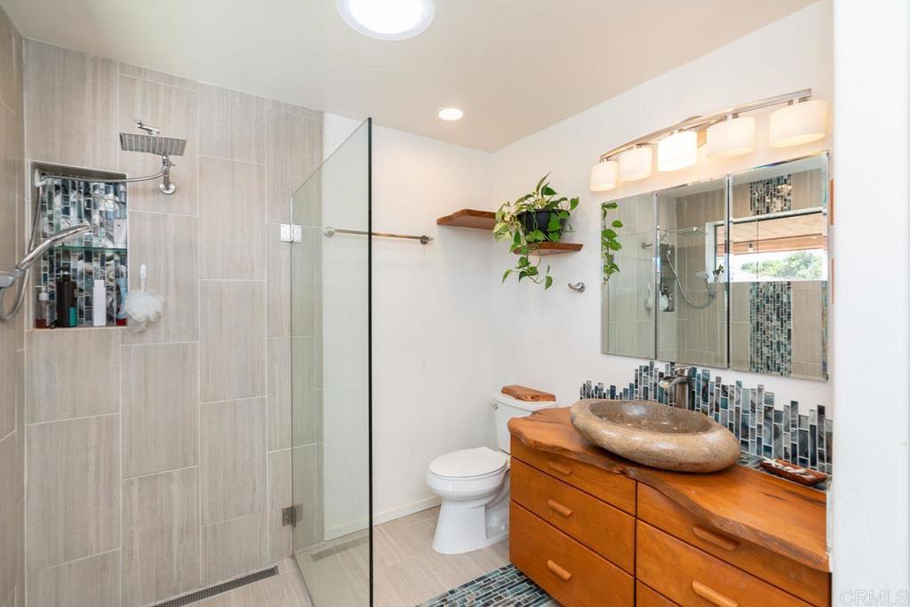315 Alpine Heights Road Alpine, CA 91901 - Photo 18 of 42 a bathroom with a granite countertop sink a toilet and shower