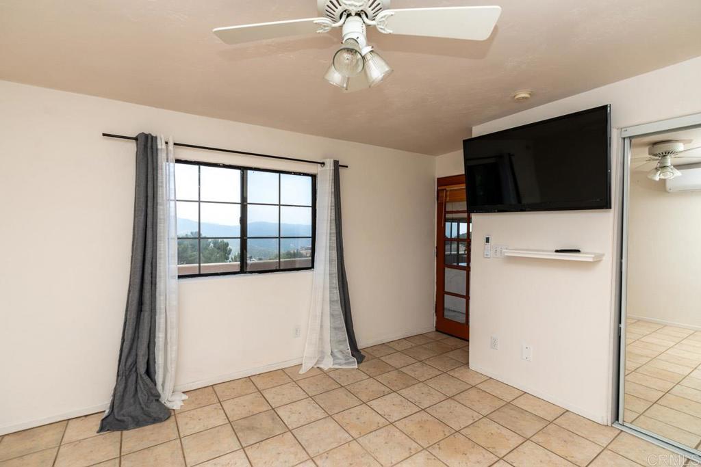 315 Alpine Heights Road Alpine, CA 91901 - Photo 31 of 42 a view of a livingroom with an empty space and a window