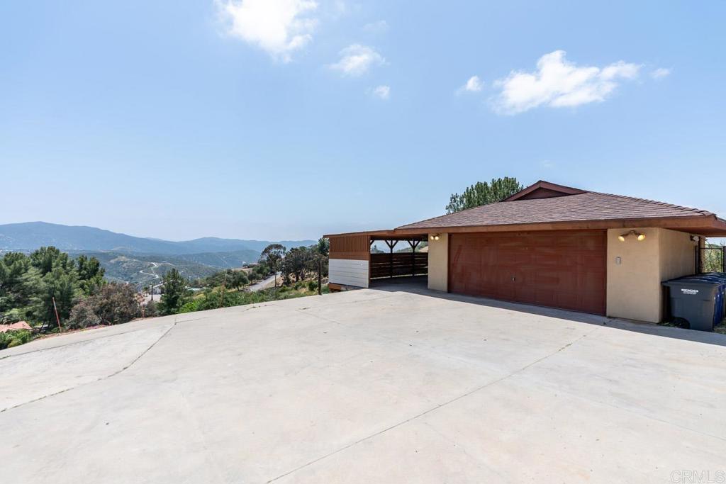 315 Alpine Heights Road Alpine, CA 91901 - Photo 35 of 42 a front view of a house with a yard and garage