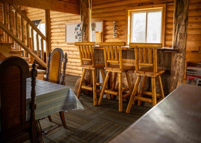 80 Sapling Lane Craig, CO 81625 - Photo 17 of 20 a view of a dining room with wooden floor and windows