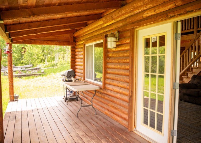 80 Sapling Lane Craig, CO 81625 - Photo 6 of 20 a view of a living room with wooden floor and a large window