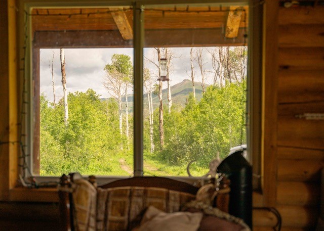 80 Sapling Lane Craig, CO 81625 - Photo 7 of 20 a view of a room that has a bed and a window