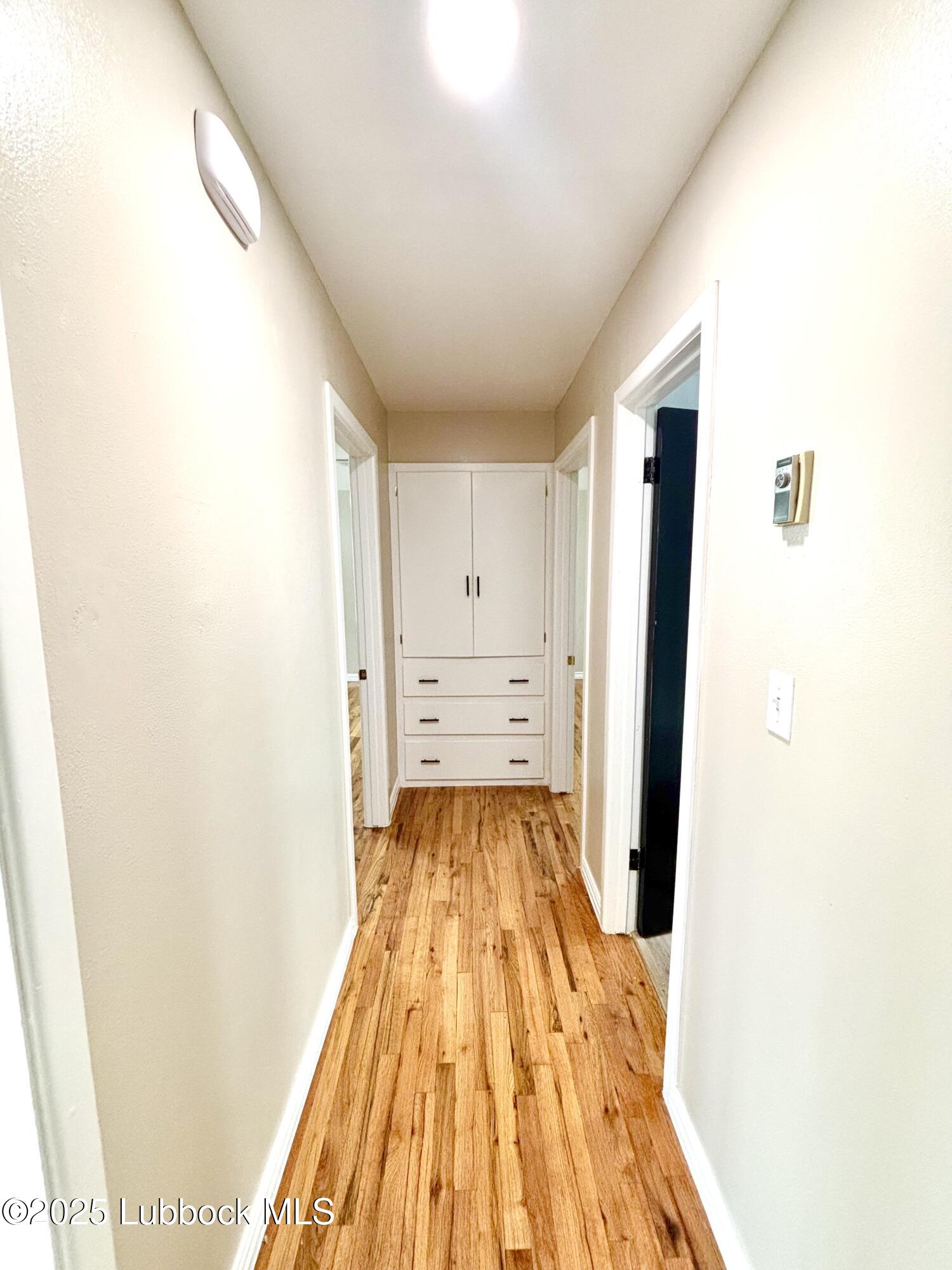 815 Amarillo Plainview, TX 79072 - Photo 10 of 17 a view of a bedroom with wooden floor