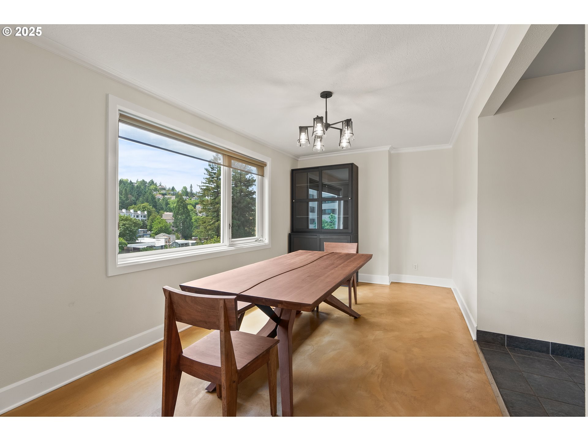 2211 Southwest Park Place, Unit 903 Portland, OR 97205 - Photo 13 of 34 a view of a dining room with furniture and window
