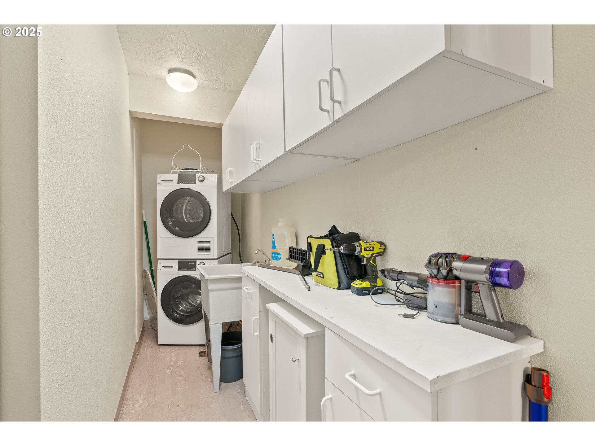 2211 Southwest Park Place, Unit 903 Portland, OR 97205 - Photo 17 of 34 a kitchen view of a sink dishwasher and a stove with wooden floor
