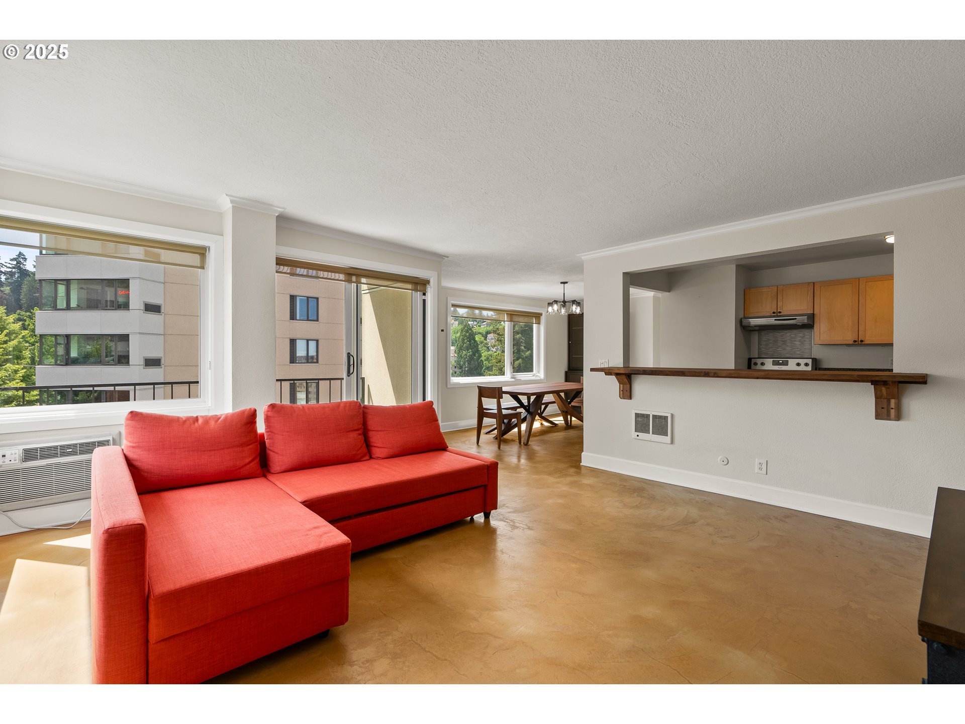 2211 Southwest Park Place, Unit 903 Portland, OR 97205 - Photo 8 of 34 a living room with furniture and a wooden floor