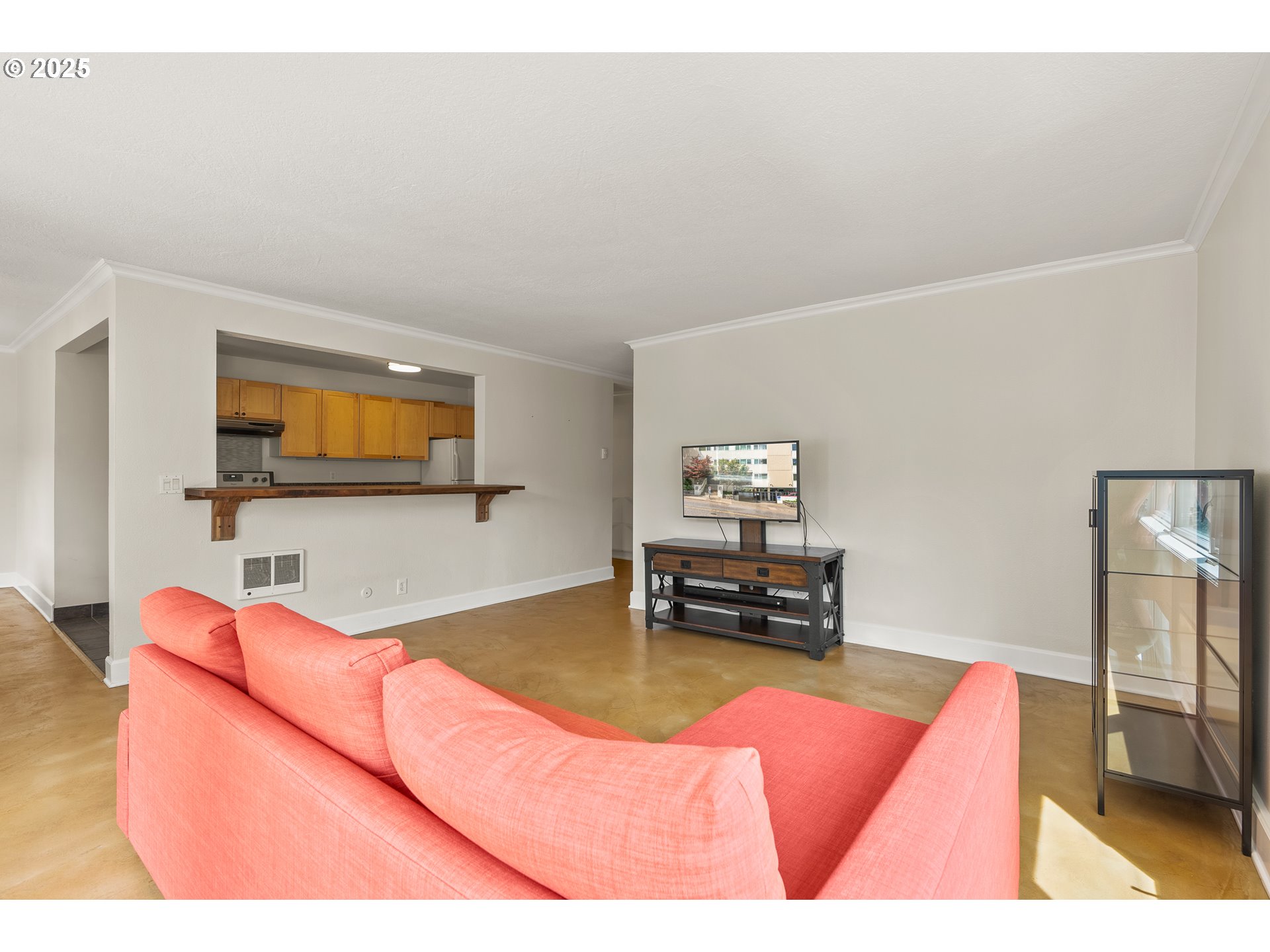 2211 Southwest Park Place, Unit 903 Portland, OR 97205 - Photo 10 of 34 a living room with furniture and a flat screen tv