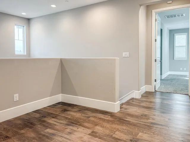a view of a livingroom with a chandelier fan