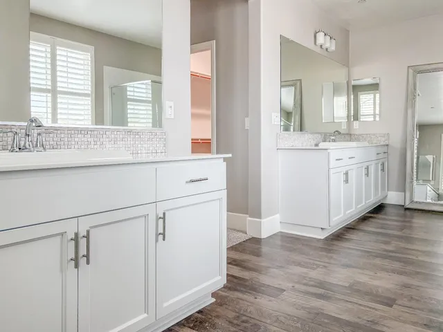 a white bath tub sitting next to a window