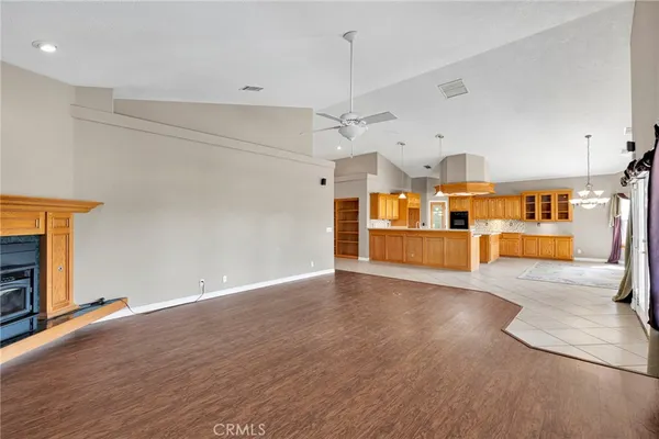 a view of a kitchen with a sink and a refrigerator