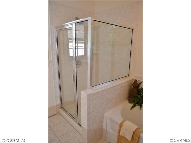 3707 Bailey Farm Road Moseley, VA 23120 - Photo 8 of 12 a bathroom with a shower and a sink
