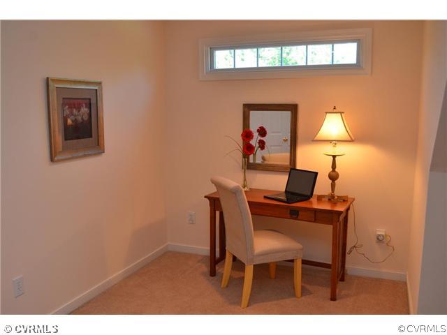 3707 Bailey Farm Road Moseley, VA 23120 - Photo 10 of 12 a dining room with a table and chair