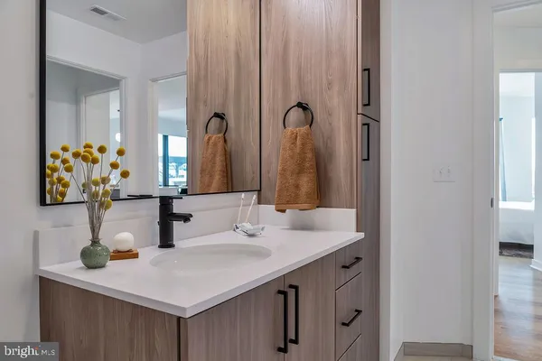 a kitchen with stainless steel appliances a refrigerator and a stove top oven