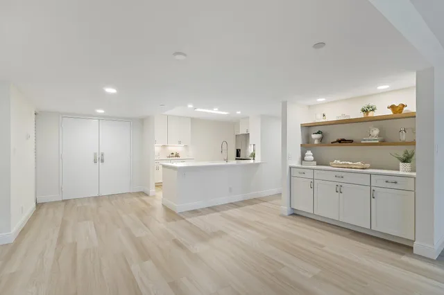 a bathroom with double sink and a mirror
