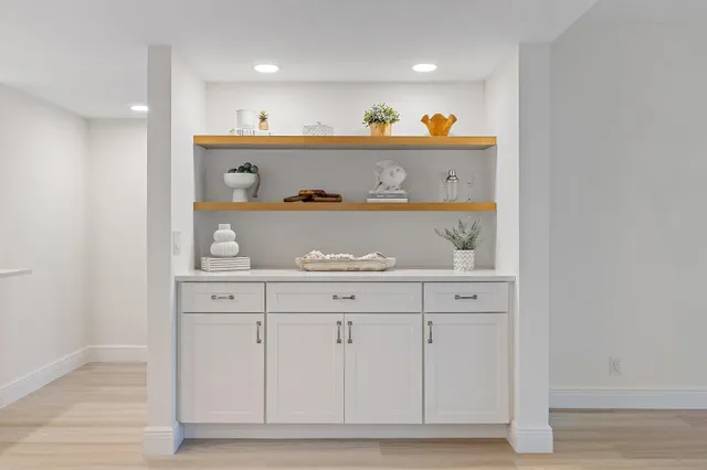 a bathroom with a sink double vanity granite and a mirror