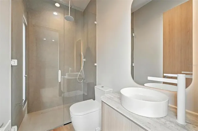 a spacious bedroom with a large bed and a large window