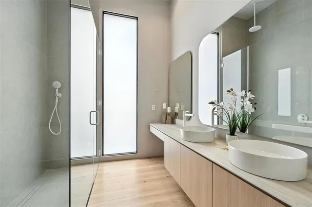 a living room with furniture and large windows