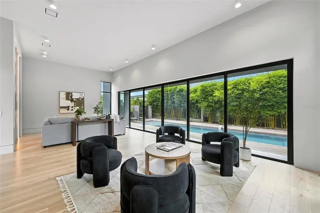 a view of a chairs and table in backyard