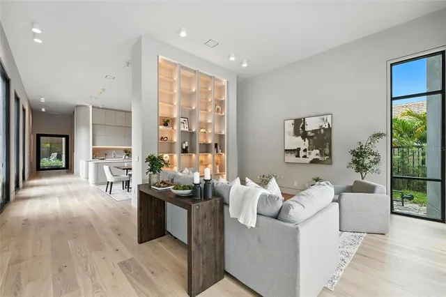 a view of a dining room with furniture window and wooden floor