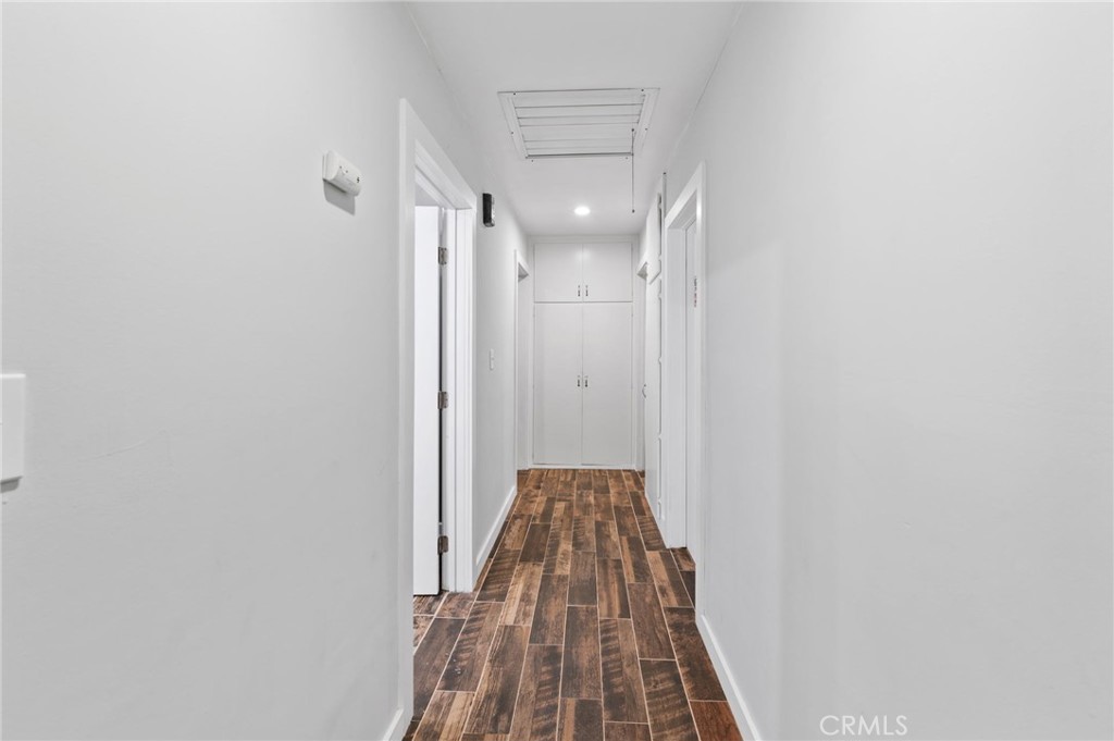 40040 Ross Road Fallbrook, CA 92028 - Photo 13 of 27 a view of a hallway with wooden floor and closet