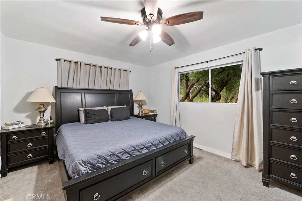 40040 Ross Road Fallbrook, CA 92028 - Photo 15 of 27 a bedroom with a bed and a dresser