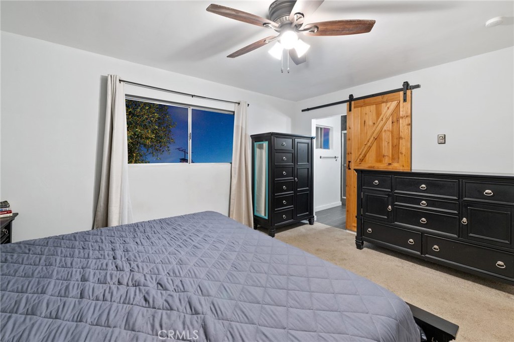 40040 Ross Road Fallbrook, CA 92028 - Photo 16 of 27 a bedroom with a bed and a dresser