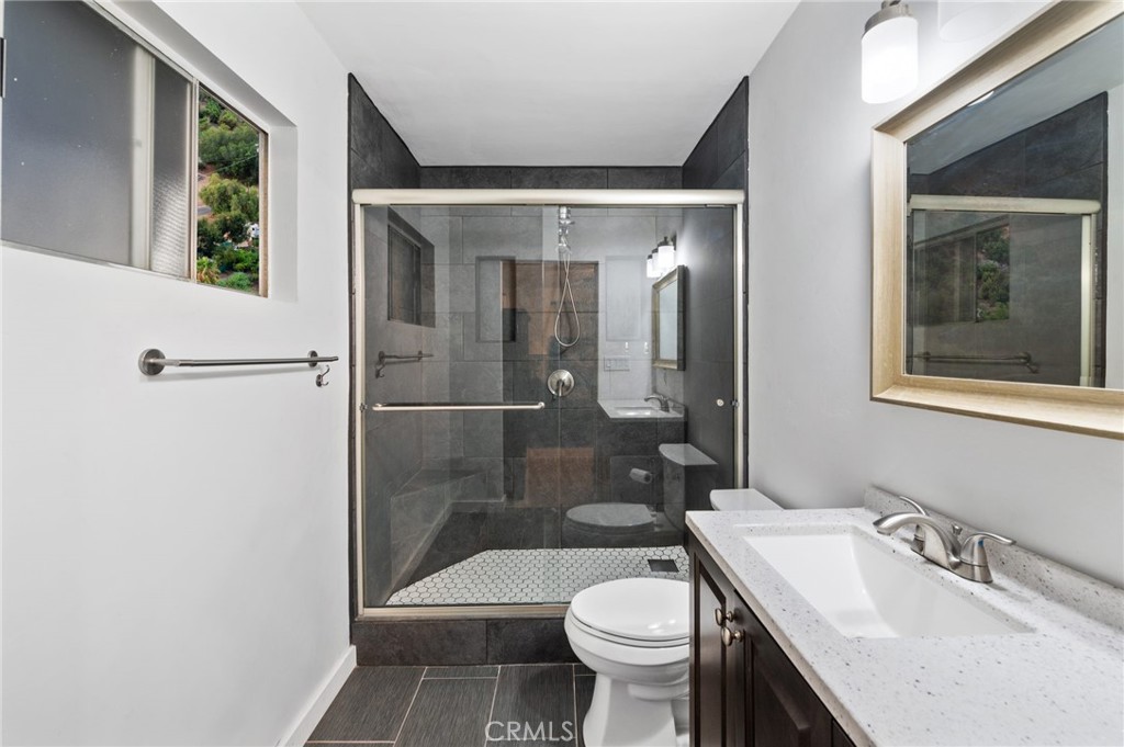40040 Ross Road Fallbrook, CA 92028 - Photo 17 of 27 a bathroom with a sink and a mirror