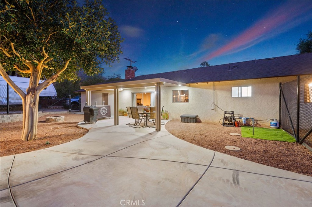 40040 Ross Road Fallbrook, CA 92028 - Photo 20 of 27 a view of a house with backyard and porch