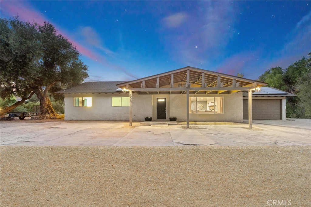 40040 Ross Road Fallbrook, CA 92028 - Photo 2 of 27 a front view of a house with a yard and garage