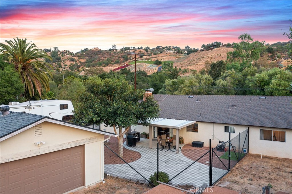 40040 Ross Road Fallbrook, CA 92028 - Photo 22 of 27 a view of a patio with a table and chairs