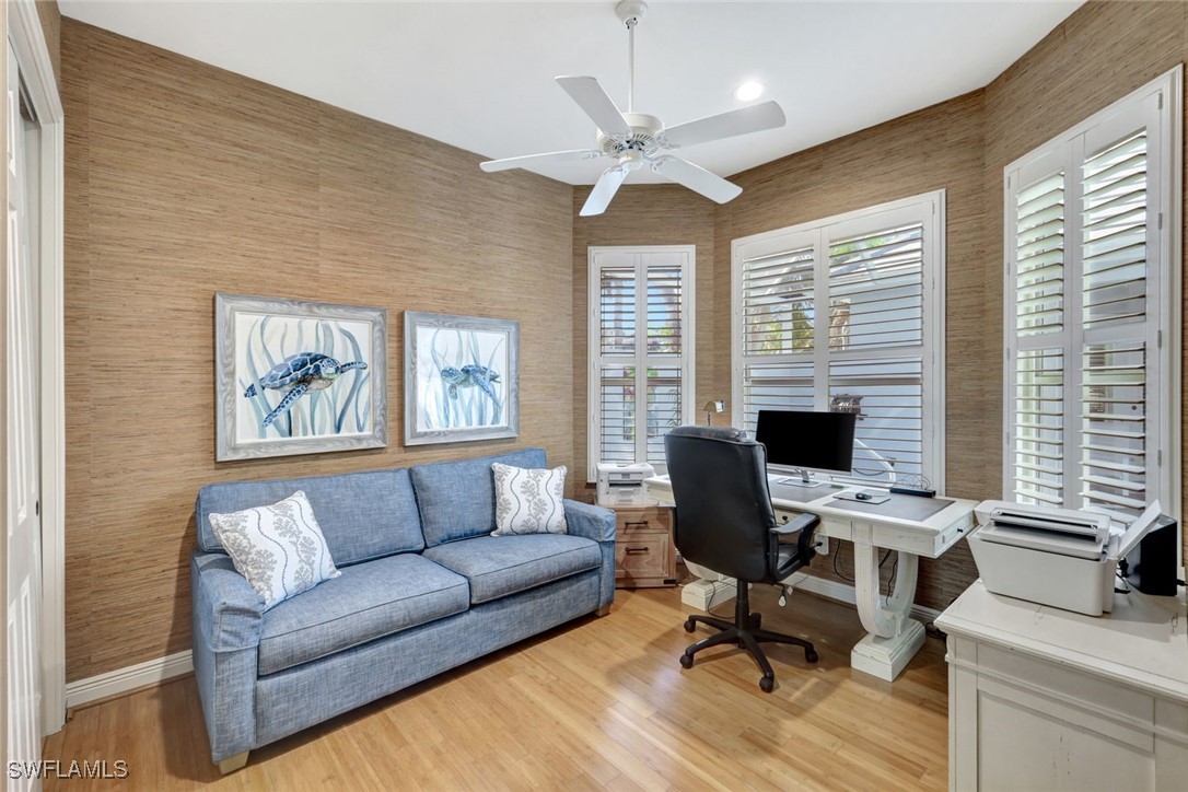 2450 Wulfert Road Sanibel, FL 33957 - Photo 31 of 44 a view of a livingroom with workspace and a couch