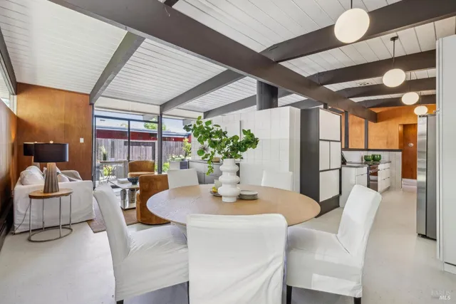 a dining room with furniture and window