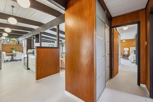 a view of a patio with dining table and chairs