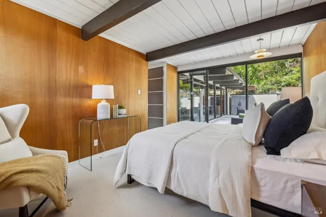 an outdoor living space with patio furniture and garden