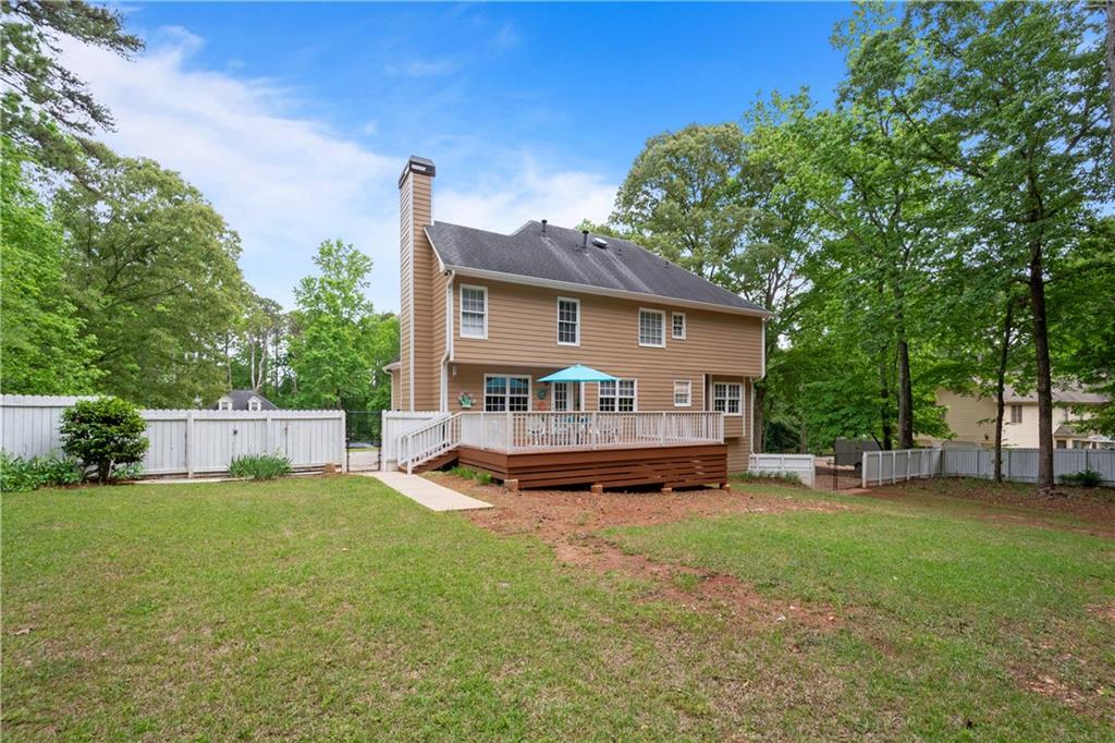 405 Ridgemont Drive Fayetteville, GA 30215 - Photo 35 of 43 a view of a house with a big yard and large trees
