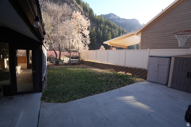 3711 North Canyon Road Provo, UT 84604 - Photo 35 of 42 View of yard with a patio and a mountain view