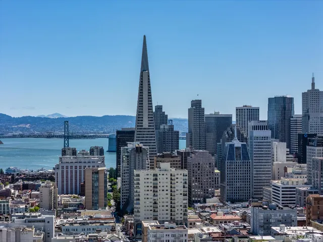 a view of city with tall buildings