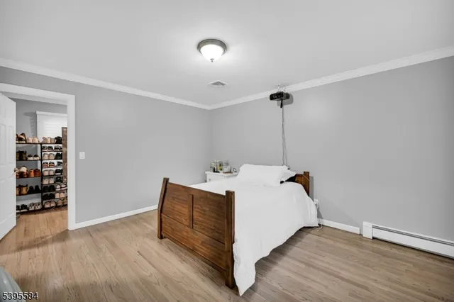 a bed room with a bed and a book shelf