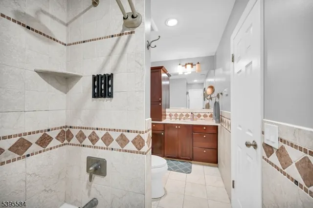 a bathroom with a bathtub sink and mirror